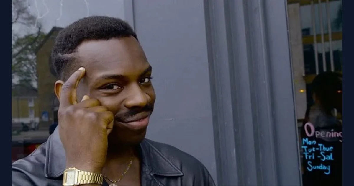Kayode Ewumi smiling and pointing to his temple as the Roll Safe character (reference preview)